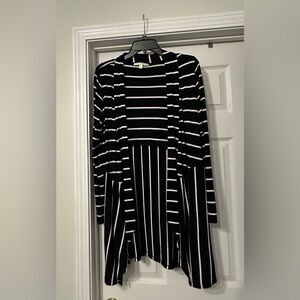 Cyrus long sleeve Cardigan Sweater is a size medium.